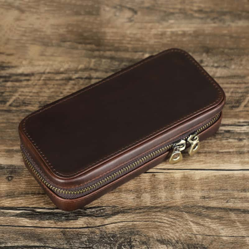 VCD-E exquisite handcrafted retro fashion dual teeth zipper 1-slot cowhide leather watch travel case is portable with rectangle shape.